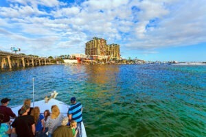 view of destin harbor and bridge from boat cruise